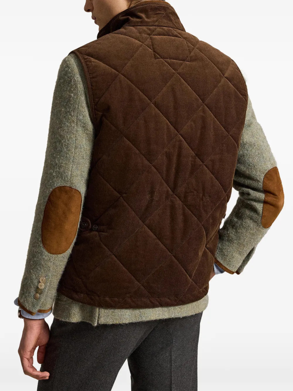 Brown jacket worn by a person, showing the jacket fit
