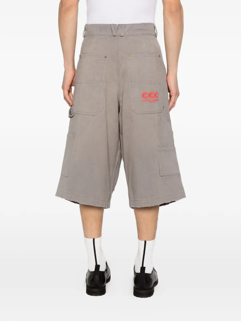 Grey shorts worn by a person, showing the shorts' fit