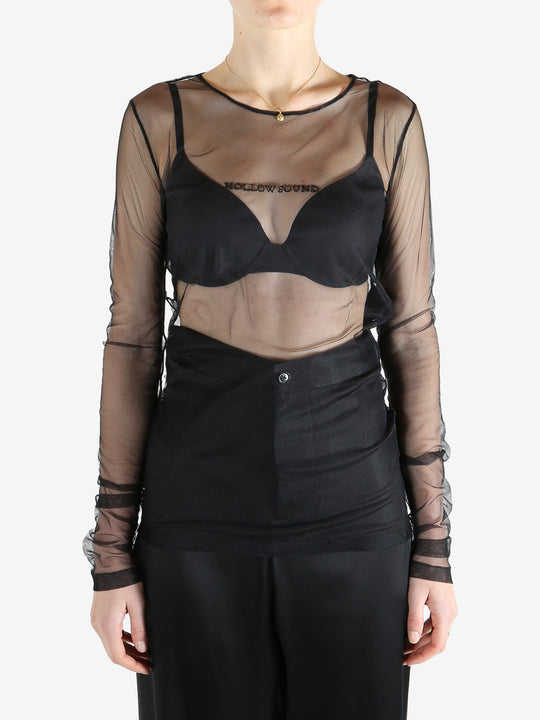 Black top worn by a person, showing the top's fit