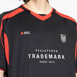 Close up of black t-shirt, showing texture of the Polyester fabric