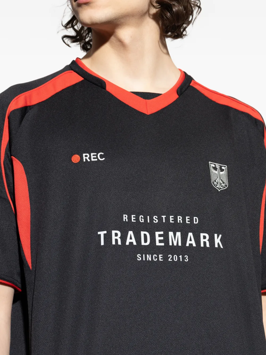 Close up of black t-shirt, showing texture of the Polyester fabric