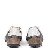 green sneakers, back view 