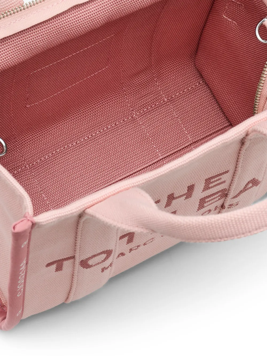 Close up of the pink bag, showing texture of the cotton fabric
