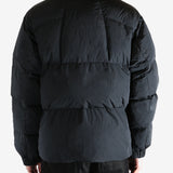 Black jacket worn by a person, showing the jacket fit