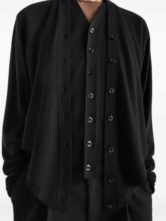 Black top worn by a person, showing the top fit