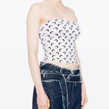 White tops worn by a person, showing the tops fit