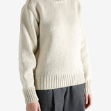 Tan sweater worn by a person, showing the sweater fit