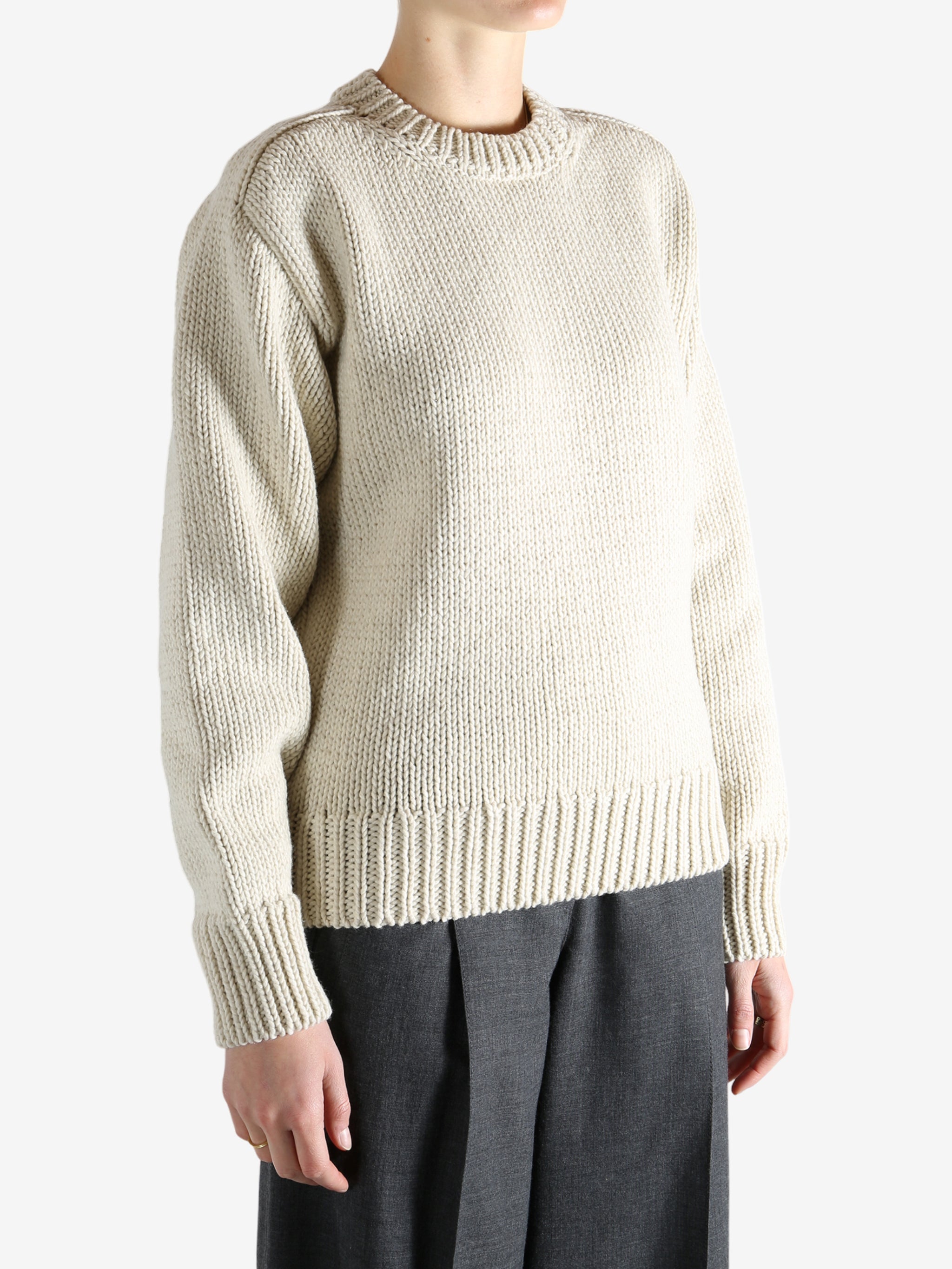 Tan sweater worn by a person, showing the sweater fit