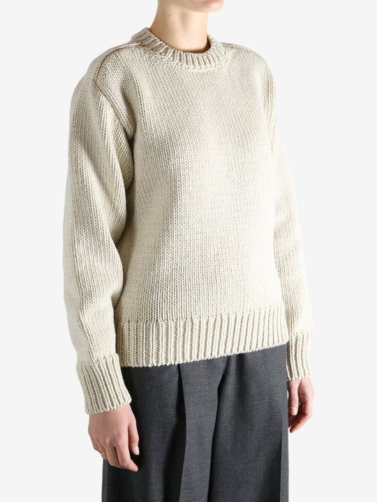 Tan sweater worn by a person, showing the sweater fit