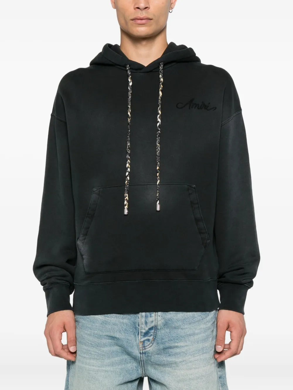 Black hoodie worn by a person, showing the hoodie's fit