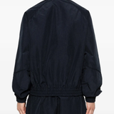 Blue jacket worn by a person, showing the jacket's fit