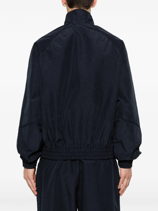 Blue jacket worn by a person, showing the jacket's fit