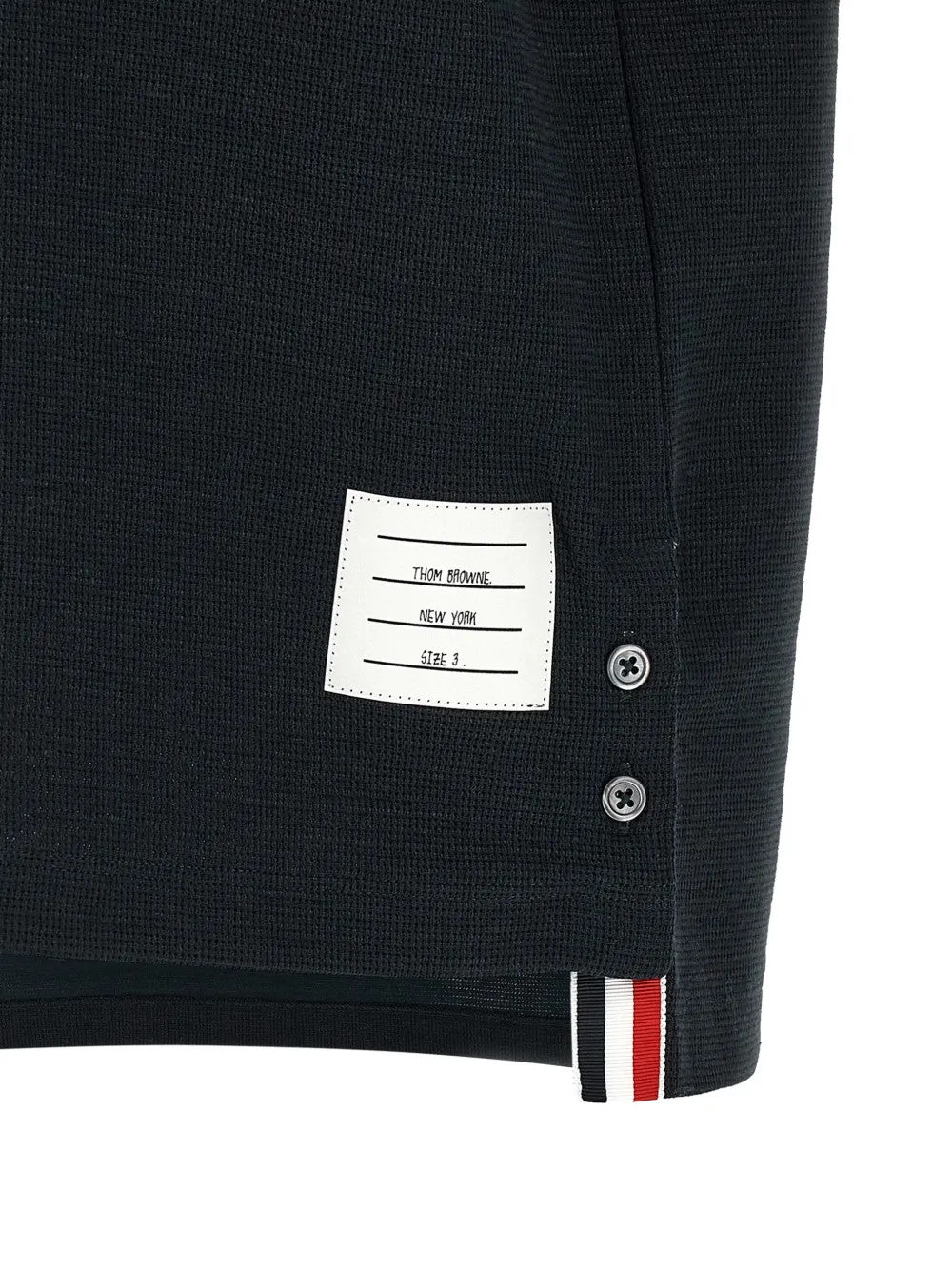 Close up of Navy t-shirt, showing texture of the 55% cotton/ 36% linen/ 7% polyamide/ 2% elastane fabric