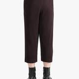 Brown pants worn by a person, showing the pants's fit