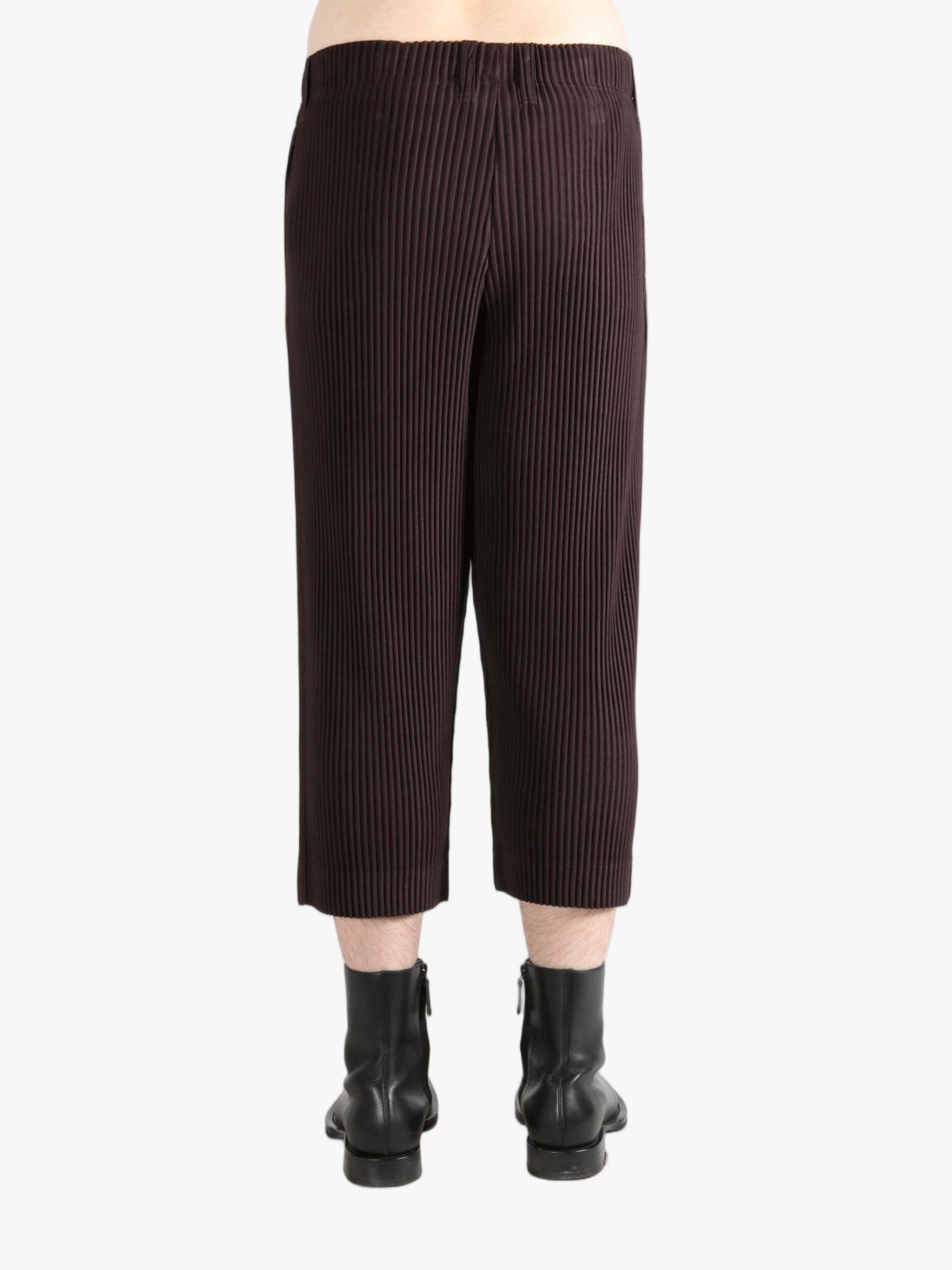 Brown pants worn by a person, showing the pants's fit
