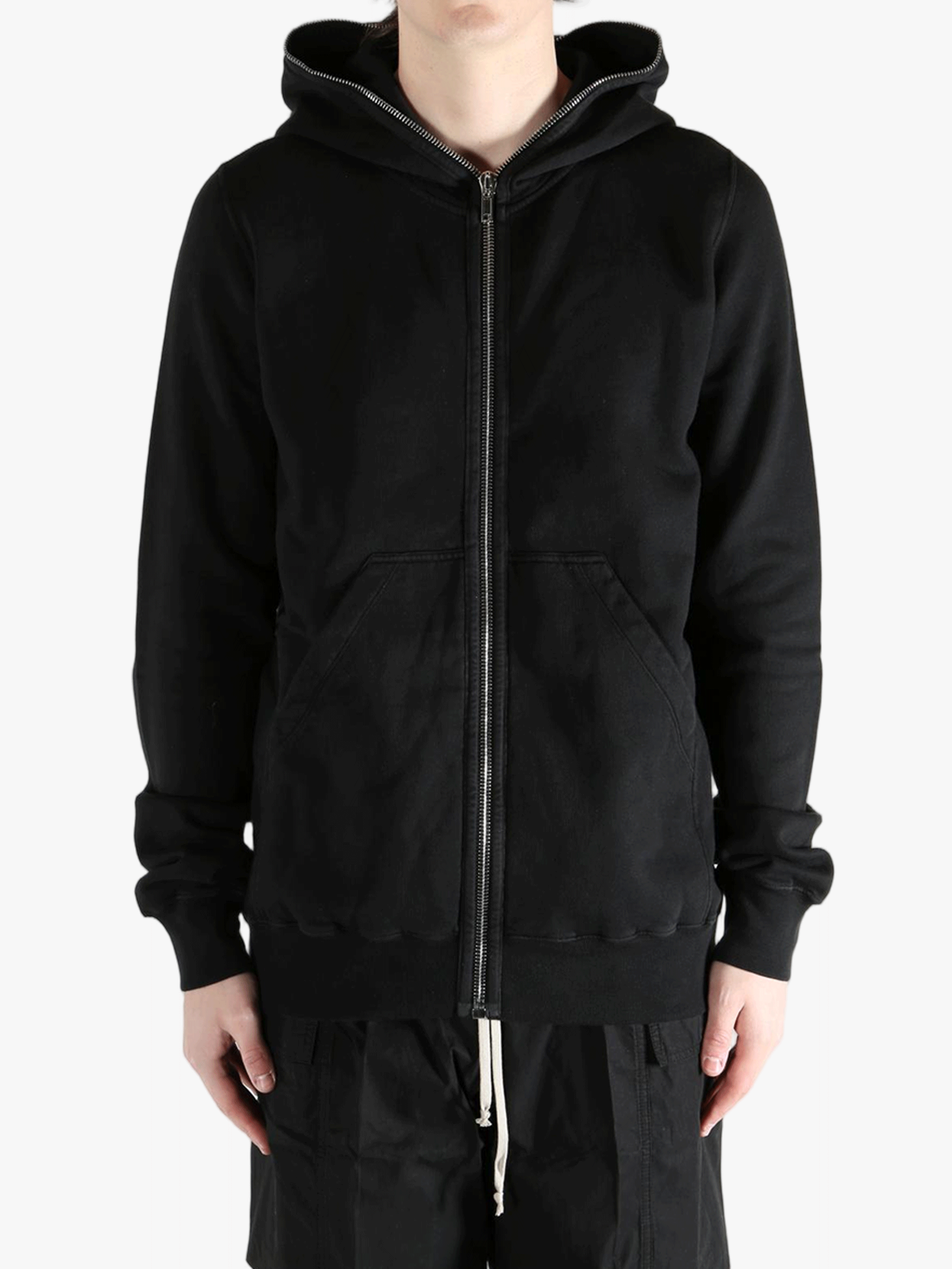 Black hoodie worn by a person, showing the hoodie fit