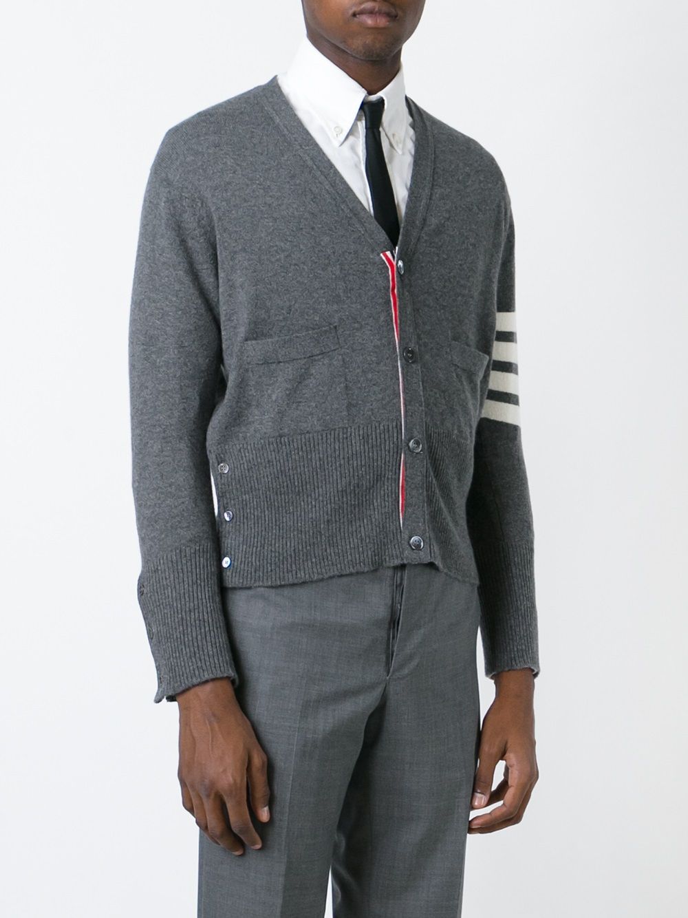 Grey knitwear worn by a person, showing the knitwear’s fit