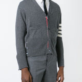 Grey knitwear worn by a person, showing the knitwear’s fit