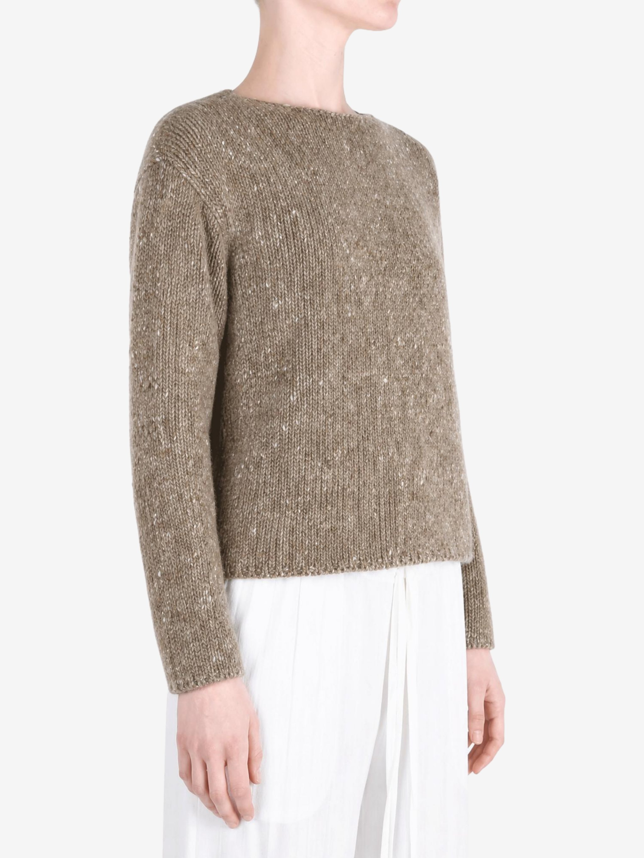 Tan knitwear worn by a person, showing the knitwear fit
