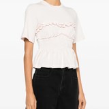 pink t-shirt worn by a person, showing the  t-shirt fit