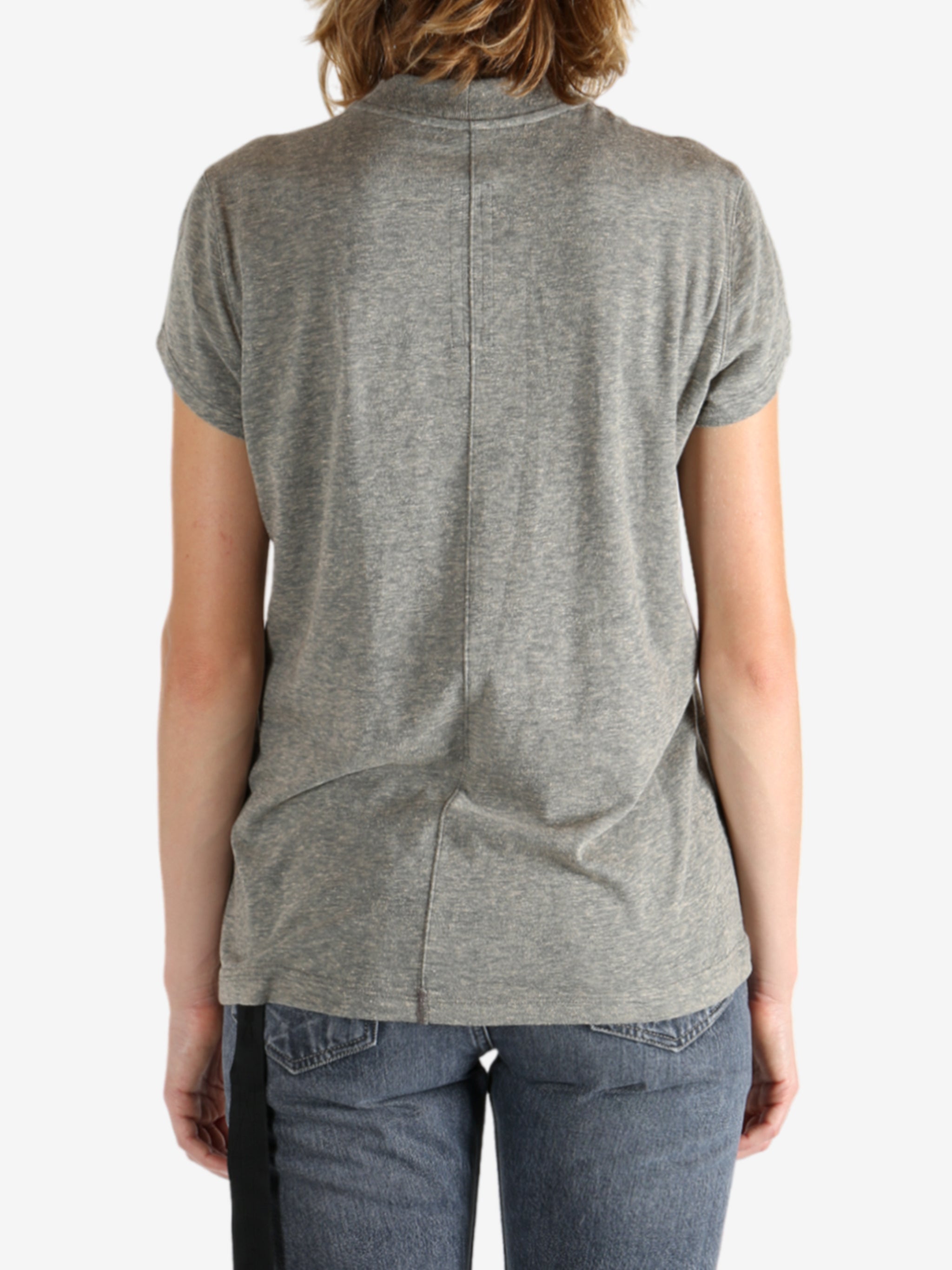 Grey t-shirt worn by a person, showing the shirt's fit