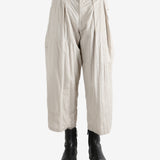 White pants worn by a person, showing the pants fit