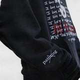 Black hoodie worn by a person, showing the hoodie fit