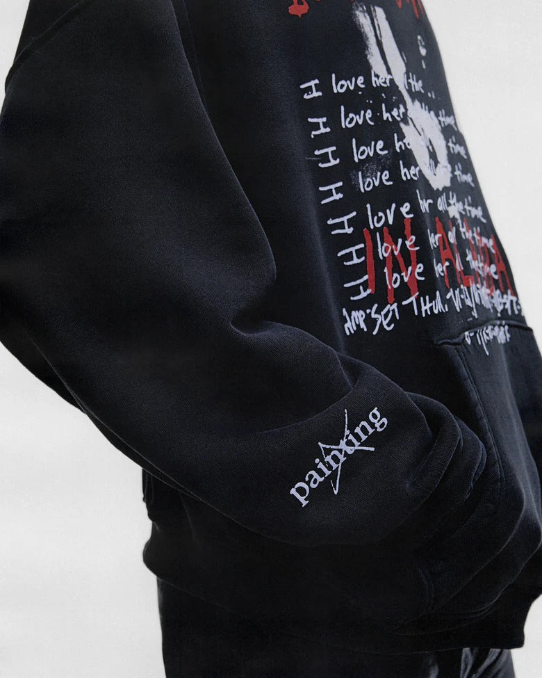 Black hoodie worn by a person, showing the hoodie fit