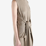 Beige top worn by a person, showing the top fit