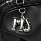 Close up of black bags, showing texture of the lamb leather fabric