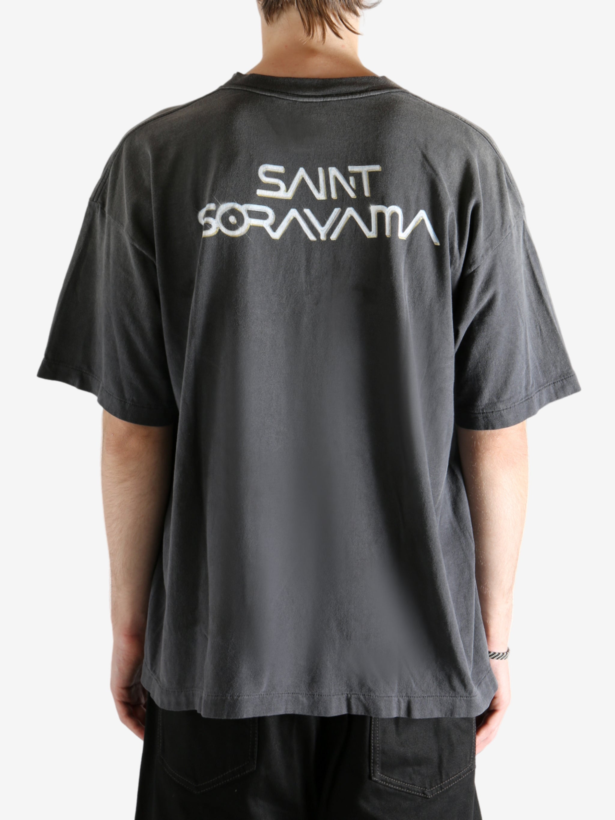 Black t-shirt worn by a person, showing the t-shirt's fit