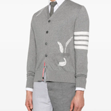 Grey knitwear worn by a person, showing the knitwear fit