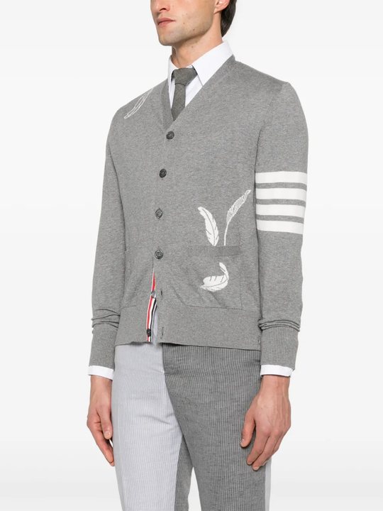 Grey knitwear worn by a person, showing the knitwear fit