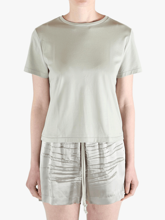 Grey t-shirt worn by a person, showing the shirt's fit