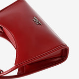 Close up of red bag, showing texture of the leather fabric