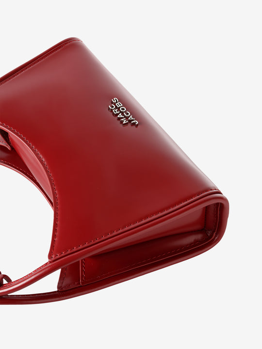 Close up of red bag, showing texture of the leather fabric