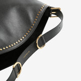Close up of black bags, showing texture of the calf leather fabric