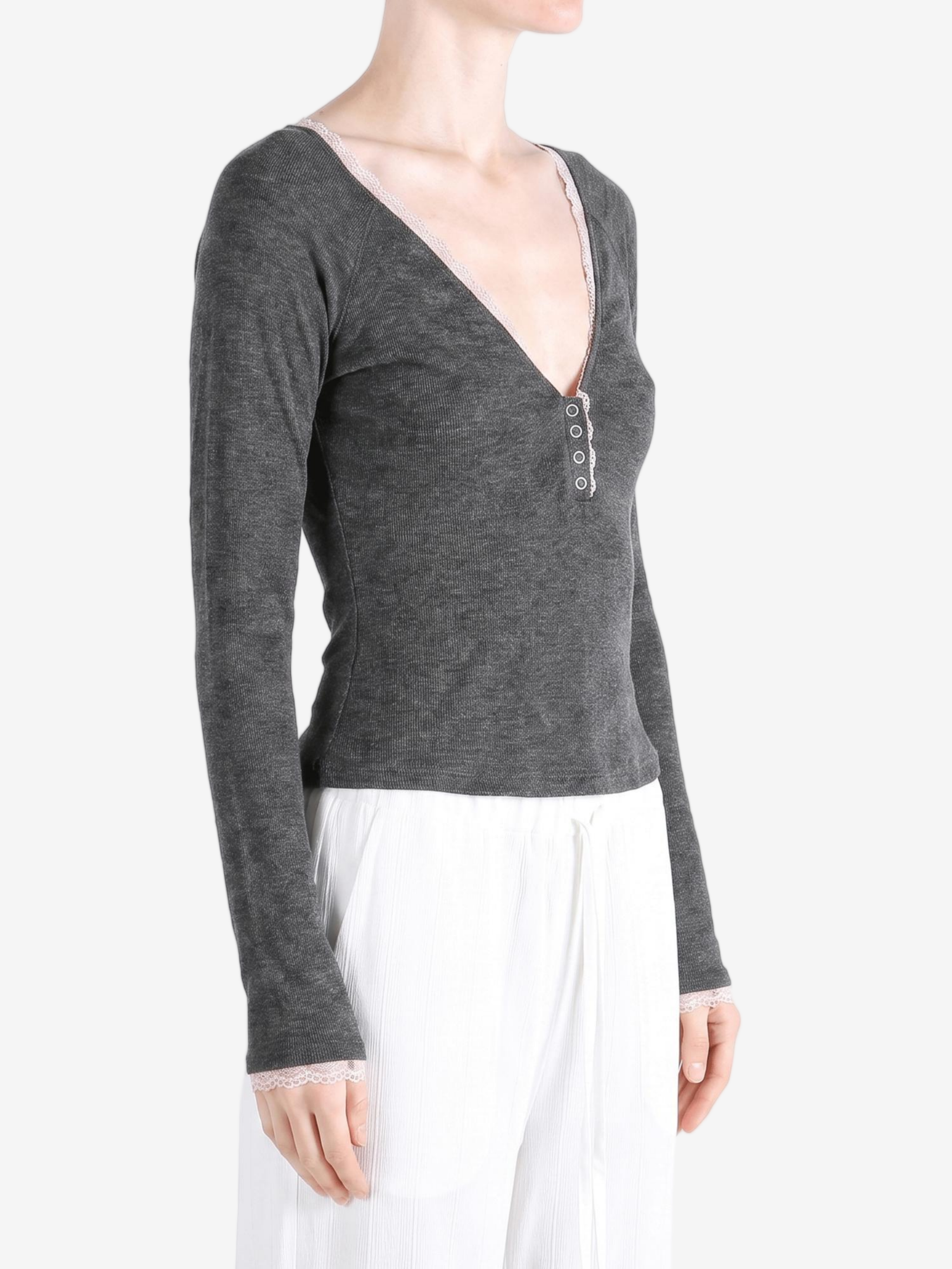 Grey top worn by a person, showing the top fit