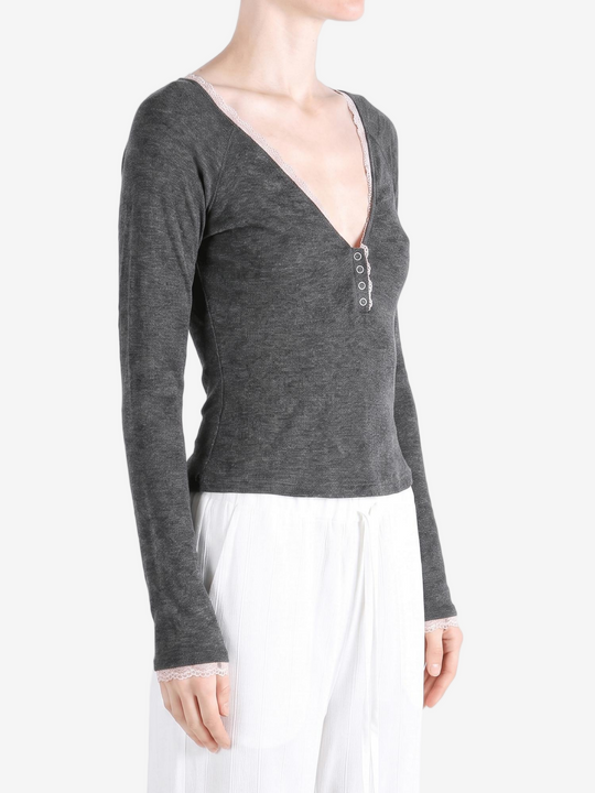 Grey top worn by a person, showing the top fit