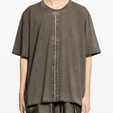 Grey t-shirts worn by a person, showing the t-shirts fit