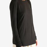 Brown top worn by a person, showing the top fit