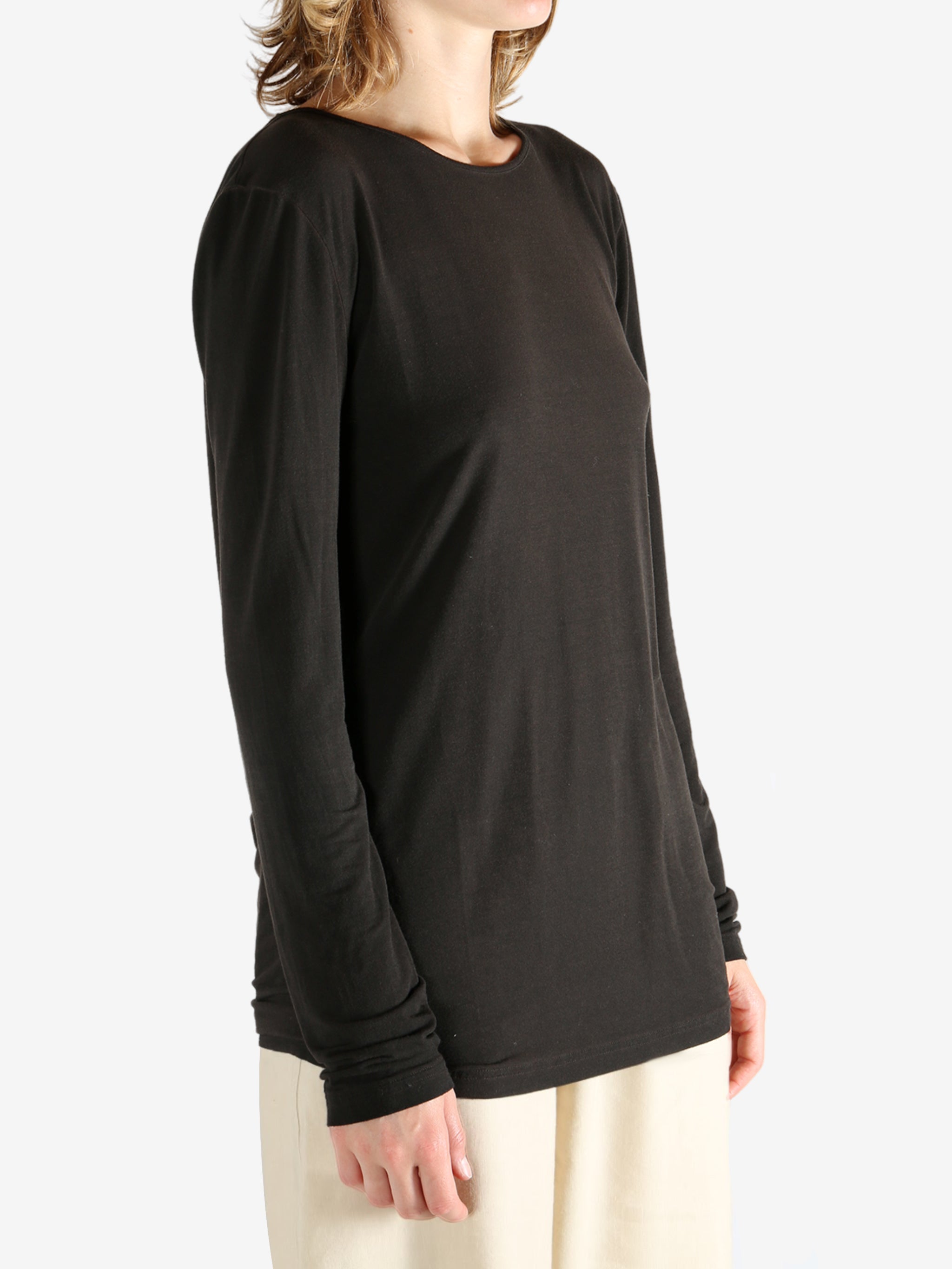 Brown top worn by a person, showing the top fit