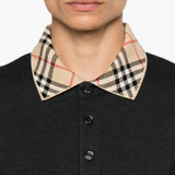 Black t-shirt worn by a person, showing the t-shirt fit