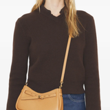 Brown bag worn by a person, showing the bag's fit