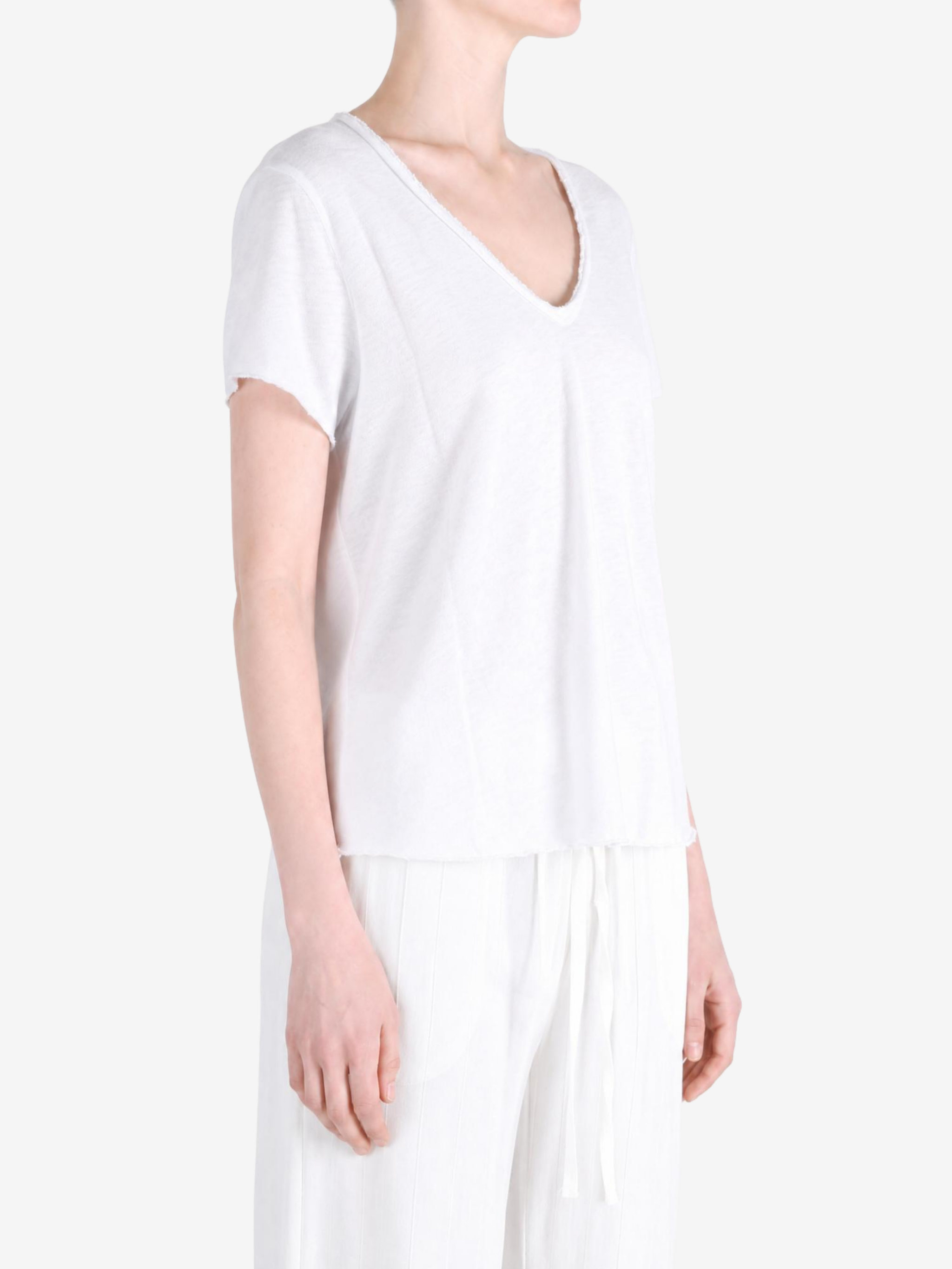 White t-shirt worn by a person, showing the t-shirt fit