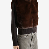 Brown sweater worn by a person, showing the sweater's fit