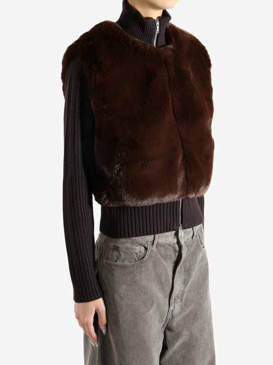 Brown sweater worn by a person, showing the sweater's fit