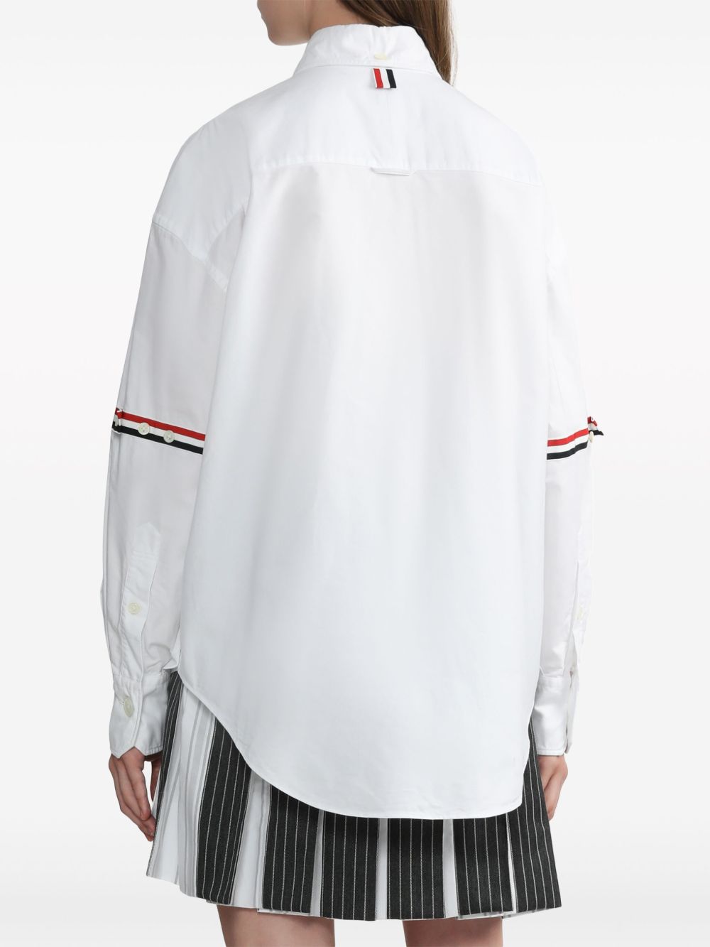 White shirt worn by a person, showing the shirt’s fit