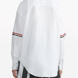 White shirt worn by a person, showing the shirt’s fit