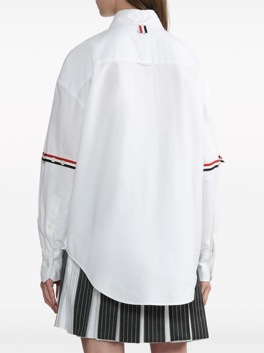 White shirt worn by a person, showing the shirt’s fit